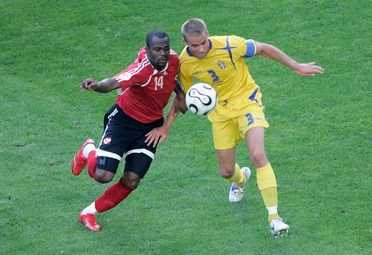 DORTMUND, GERMANY - JUNE 10: Stern John of Trinidad & Tobago battles with Olof Mellberg of Sweden during the FIFA World Cup Germany 2006 Group B match between Trinidad & Tobago and Sweden at the Stadium Dortmund on June 10, 2006 in Dortmund, Germany.  (Photo by Christof Koepsel/Bongarts/Getty Images)