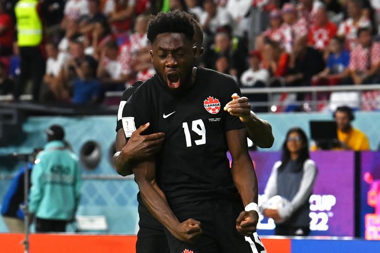 DOHA, QATAR - NOVEMBER 27: Alphonso Davies of Canada celebrates after scoring their team's first goal during the FIFA World Cup Qatar 2022 Group F match between Croatia and Canada at Khalifa International Stadium on November 27, 2022 in Doha, Qatar. (Photo by Claudio Villa/Getty Images)